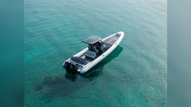 RIBCO Blade 30 anchored over turquoise water, aerial view