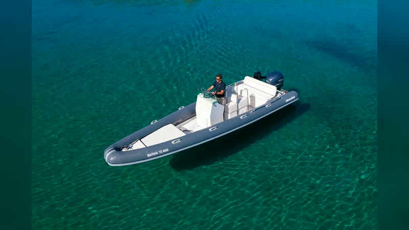Obsession 7.40 RIB over clear turquoise water