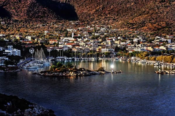 The harbour and town of Methana beneath the volcano