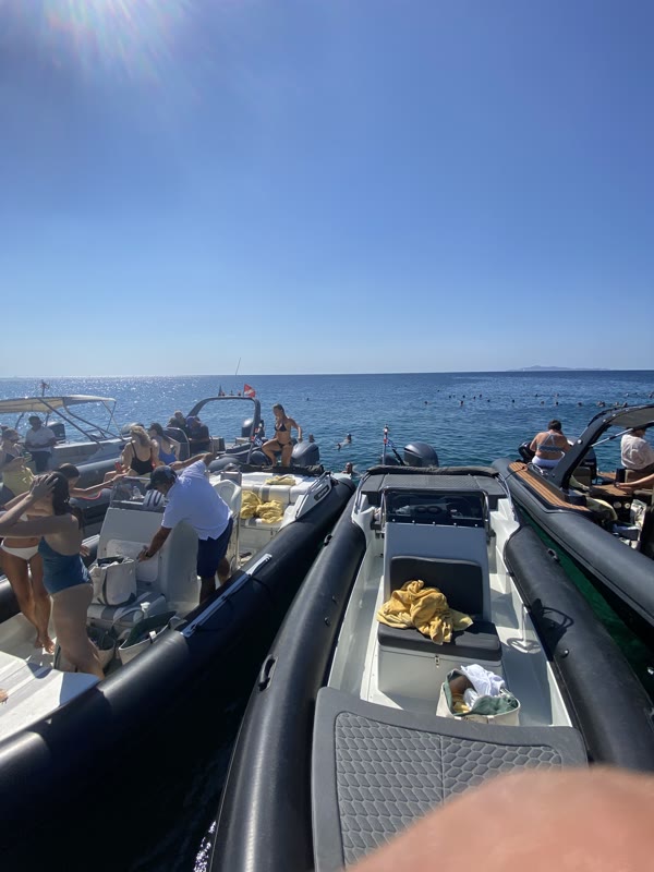 Friends aboard during a golden-hour island gathering
