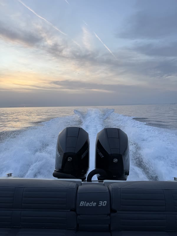 Sunset cruise — twin engines and golden sky