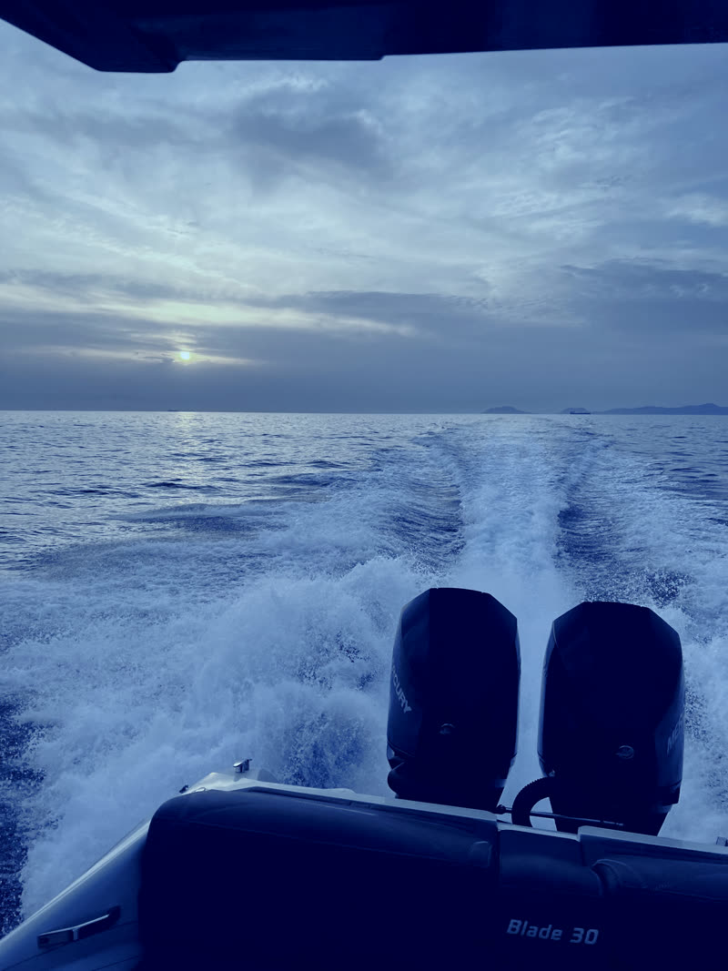 Moonlight cruise — the RIBCO Blade 30 on a silvered sea under a dusk-blue sky
