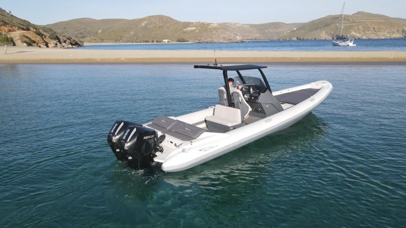 Half day cruise — the RIBCO Blade 30 moored in clear water, aerial view
